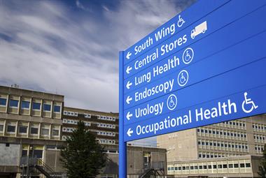 Hospital sign giving directions to different medical departments