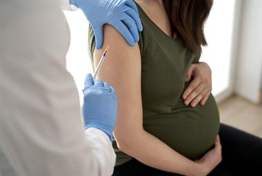 Pregnant woman being vaccinated