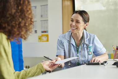 Practice nurse in patient consultation