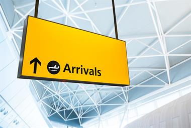 Arrivals sign at UK airport