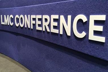 Desk with lettering 'LMC conference'