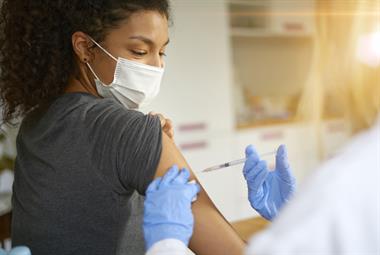Young woman receiving COVID-19 vaccine