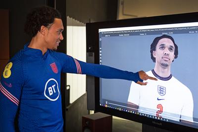 Trent Alexander-Arnold looking at his avatar 