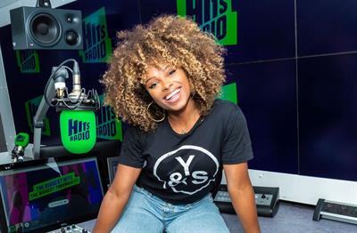 A photograph of radio presenter Fleur East in the Hits Radio studio