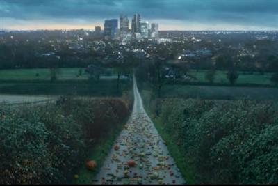 A road full of zombie-style animated vegetables approaches a city, their intentions clearly malevolent