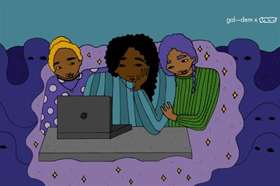 Three women sit together at a laptop
