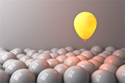 yellow appear floats above a sea of grey balloons