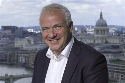 A photo of Scott Taunton with the London skyline in the background