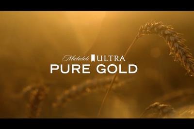 A still from an ad for Michelob, showing an ear of wheat bathed in golden light