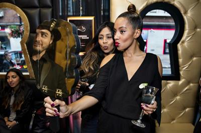 Guests drank black and gold Tanqueray cocktails at the launch event
