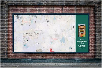 Billboard with small section promoting paint and the rest of it left bare