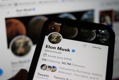 Smart phone displaying Elon Musk's Twitter profile