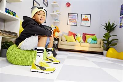 Child wearing Pokémon-branded Puma shoes