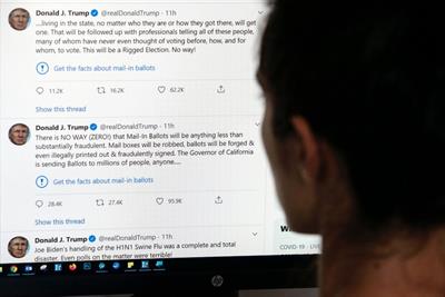 A Twitter user views Tweets by former US president Donald Trump in 2020
