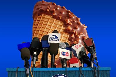A giant Choco Taco stands behind a lectern with microphones