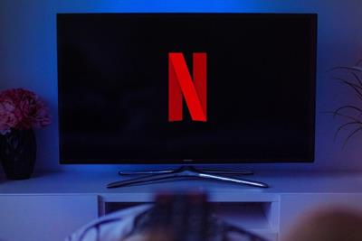 Wide screen TV monitor with Netflix logo