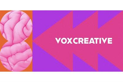 Vox Creative wordmark pointing to circles with brain texture