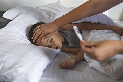 Child in bed with a fever