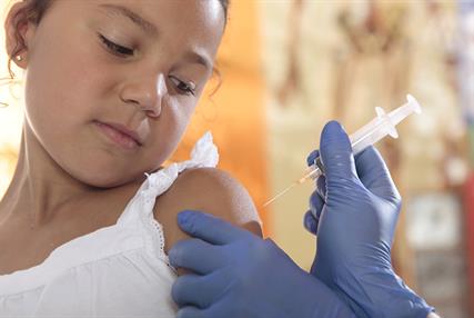 Girl receiving vaccine