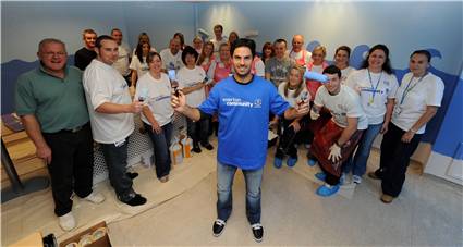 Staff from ACC Liverpool paint Alder Hay Children's hospital
