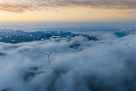 Aerial view of cloud-shrouded wind farm on February 24, 2023 in Yichang, Hubei Province, China. The IEA said 55% of all renewable energy additions in 2023 are expected to come in China (pic credit: Visual China Group / Getty Images)