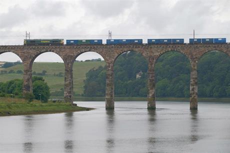 A freight train crosses the Royal Border Bridge in Northumberland on the East Coast Main Line. Image credit: Matt Buck / Flickr