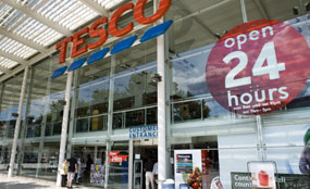 The government's design watchdog says supermarkets in town centres often use the same format as out-of-town proposals.