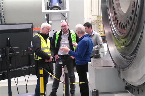 Eize de Vries (left) talks to the Thyssenkrupp Rothe Erde team at the company's Lippstadt manufacturing and testing site