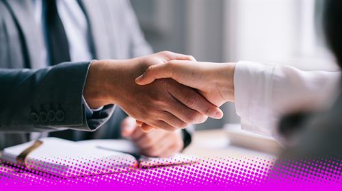 Photograph of two people shaking hands