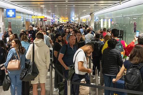 People waiting in airport queue