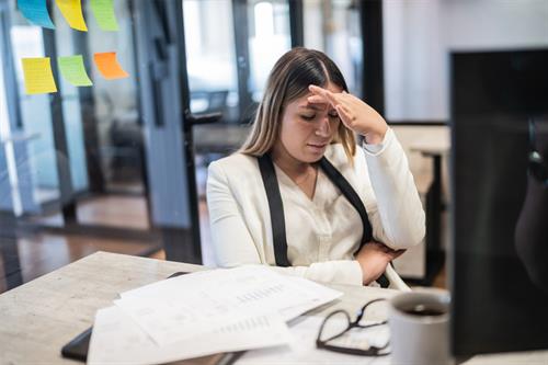 worried young businesswoman working at office 