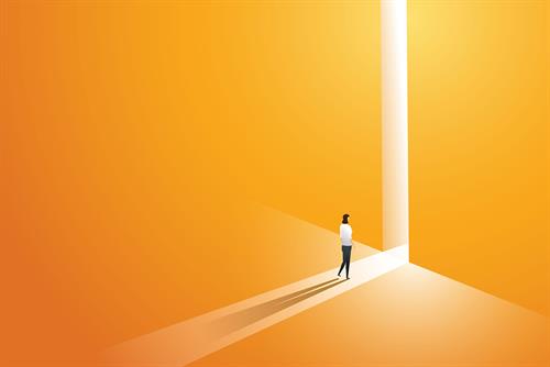 Businesswoman walking go to front of bright big shining door in the wall orange of the hole at light falls.