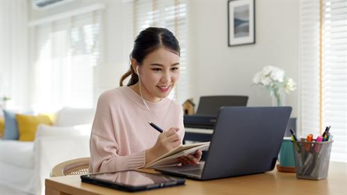 Woman Working on laptop - Advice to help you take control of your career path
