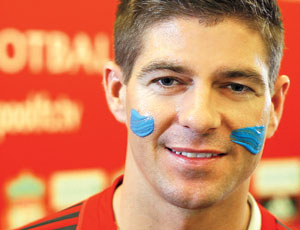 Liverpool's Steven Gerrard daubed with blue paint at the launch of Blue September