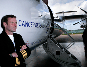 Captain Simon Burke unveils the CRUK-branded plane