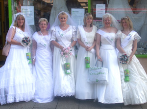 Brides: staff don gowns