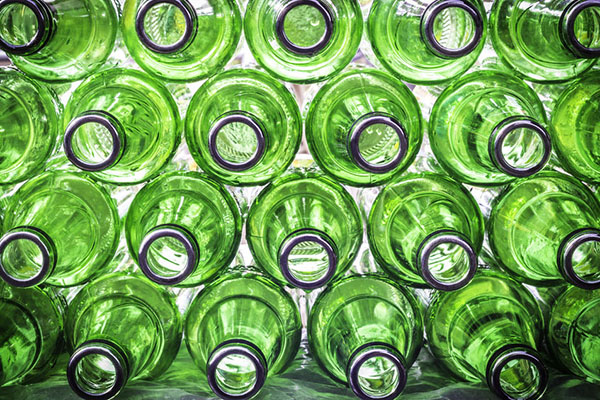 Products / Resources: stack of green glass bottles (photograph: Manus Khomkham/123RF)