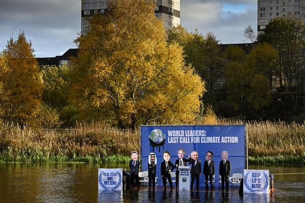 Activists dressed as world leaders sit on a raft in the Forth and Clyde canal on the ninth day of the summit (Photo by Jeff J Mitchell/Getty Images)