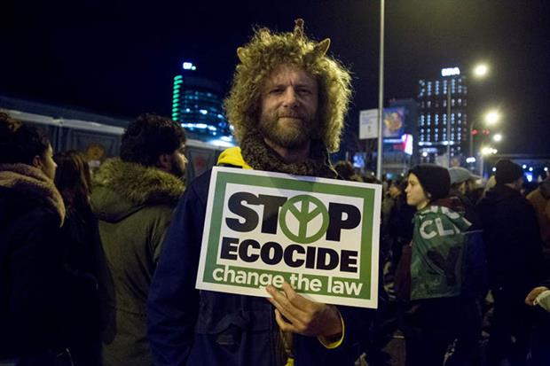 A protester holds a placard during a demonstration in Madrid, Spain, last year (Photo by Lito Lizana/SOPA Images/LightRocket via Getty Images)