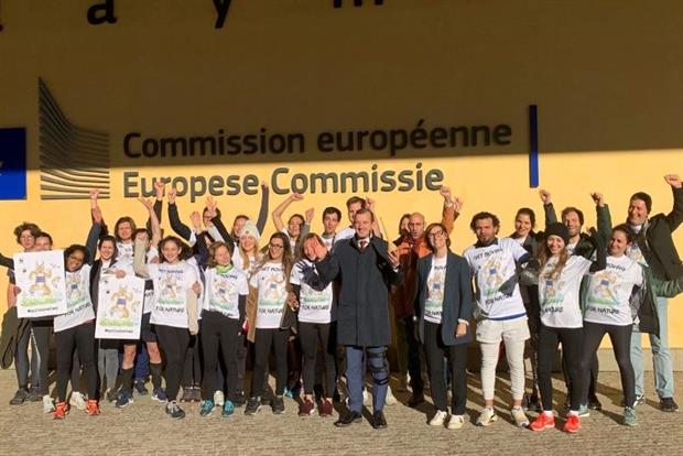 Sinkevicius, holding an ear trumpet, told youth activists the Commission will listen to their concerns about the forthcoming nature restoration law. Photo: European Commission