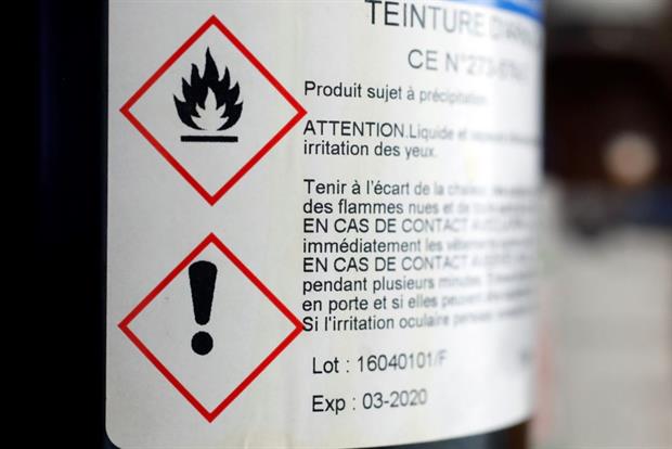 A warning label on a bottle. The Commission is proposing introducing labels for more kinds of hazardous chemicals. Photo: Godong/Universal Images Group via Getty Images