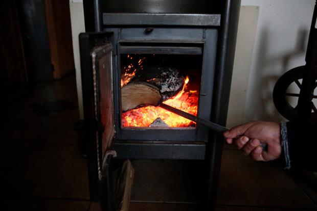 A roaring log fire in Temuco, Chile, June 2019. Air quality experts have warned a rise in wood smoke this year could have serious health impacts. Photo: LUIS HIDALGO/AFP via Getty Images