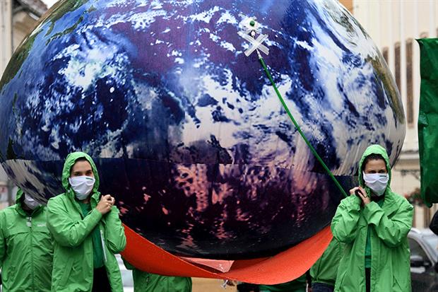 Croatian climate activists carried an inflatable earth through the streets of Zagreb earlier this month. Photograph: Denis Lovrovic/Getty Images
