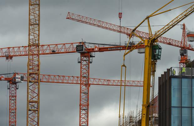 Cranes in Dublin's Docklands, June 2021. Campaigners are urging the European Commission not to abandon its pledge for a holistic approach to the built environment. Photo: Artur Widak/NurPhoto via Getty Images