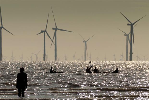 The Burbo Bank offshore wind farm seen from the banks of the Mersey, in the UK, August 2021. Prime minister Boris Johnson is set to announce a 100% clean power target by 2035. Photo: Christopher Furlong/Getty Images