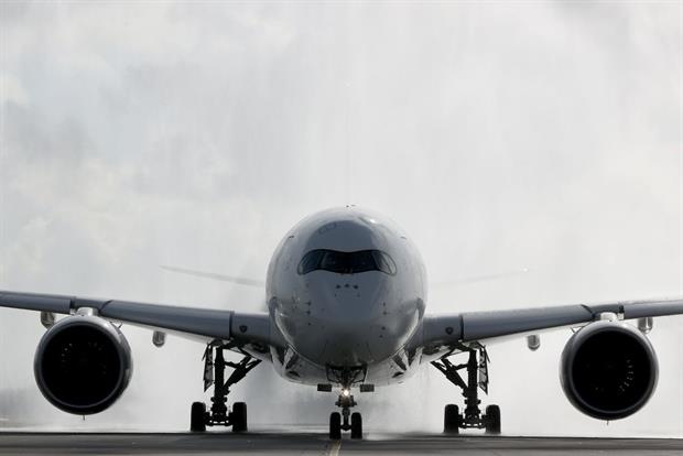 A plane goes through a water cannon before take off at Munich's Franz-Josef-Strauss international airport. Airlines believe EU rules are forcing them to run too many flights. Photo: Alexander Hassenstein/Getty Images