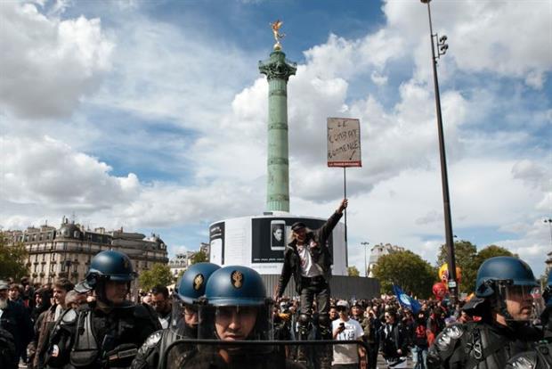 The fight begins: A protestor at the Place de la Bastille in Paris, the traditional starting point of the city's May Day marches, 2017. Photo: Salvador Banyo/NurPhoto via Getty Images