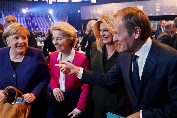 New European People's Party President Donald Tusk laughs with German chancellor Angela Merkel, Commission president-elect Ursula von der Leyen and Croatian President Kolinda Grabar Kitarovic (Photo by DENIS LOVROVIC/AFP via Getty Images)