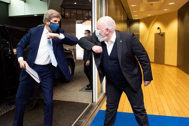 John Kerry and Frans Timmermans share a now-customary elbow bump following talks on climate policy this week. Photo: Jennifer Jacquemart / European Commission