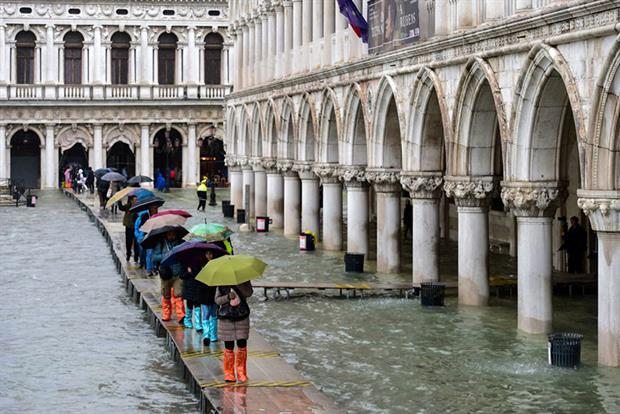 Climate change: thousands of Venetians have taken to the streets to protest over frequent flooding (Photo by MIGUEL MEDINA/AFP via Getty Images)